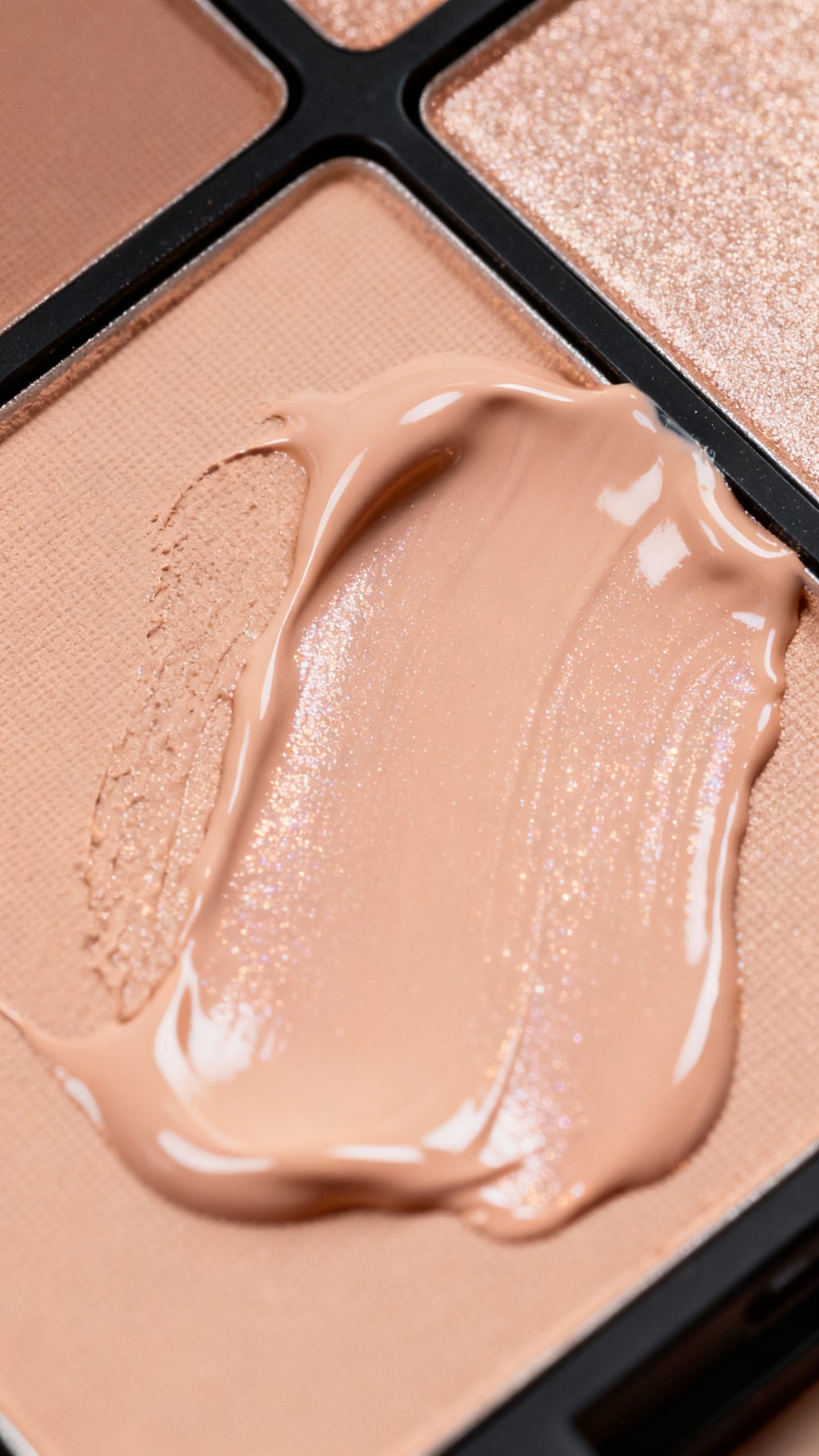 tint mixed with illuminator on palette, pro makeup flatlay